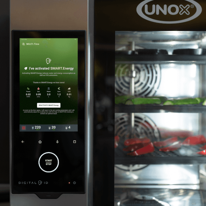 Digital control panel of a Unox commercial combi oven displaying automatic energy-saving settings.