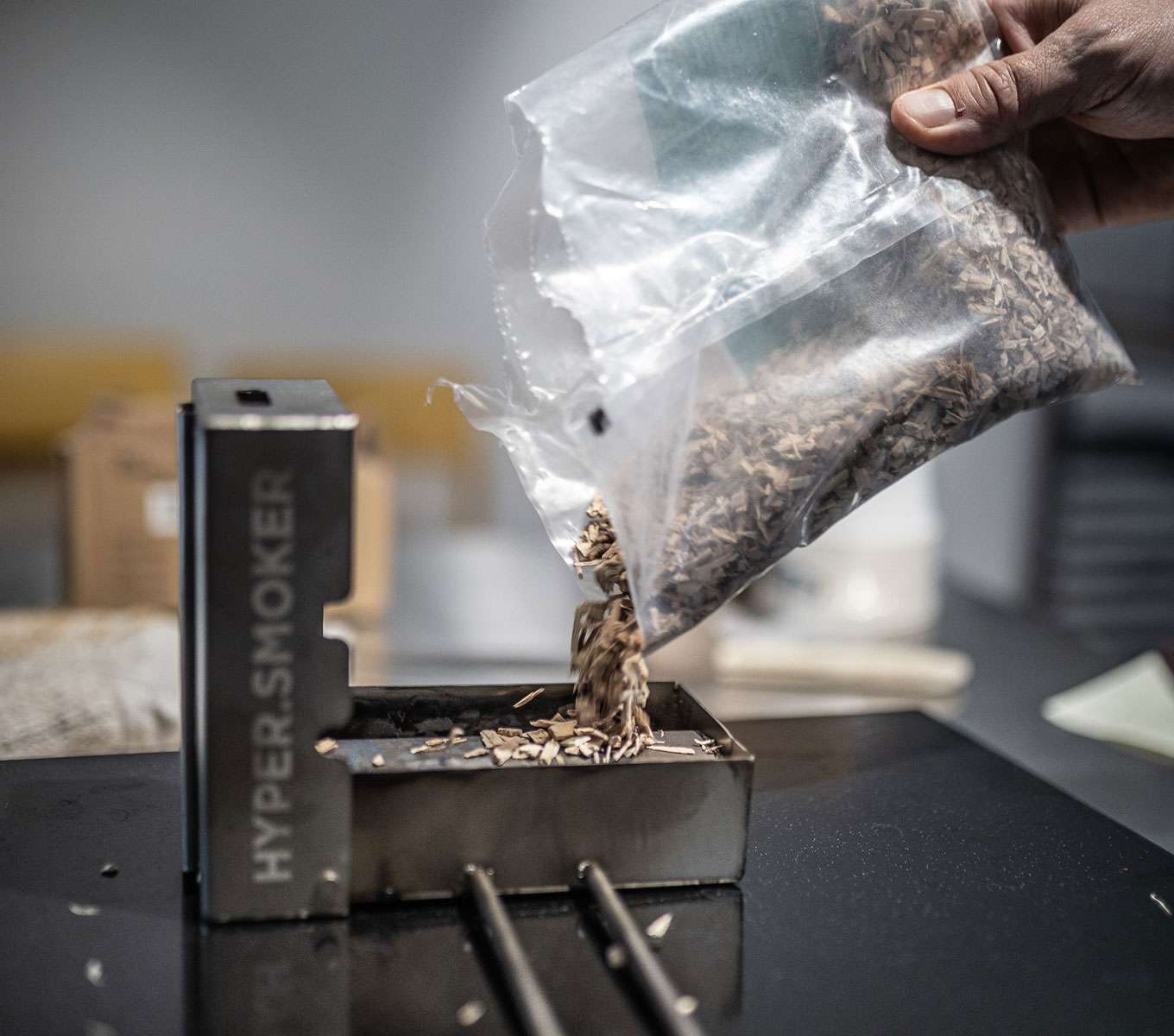 Smoking accessory for Unox combi ovens with a load of wood chips inside