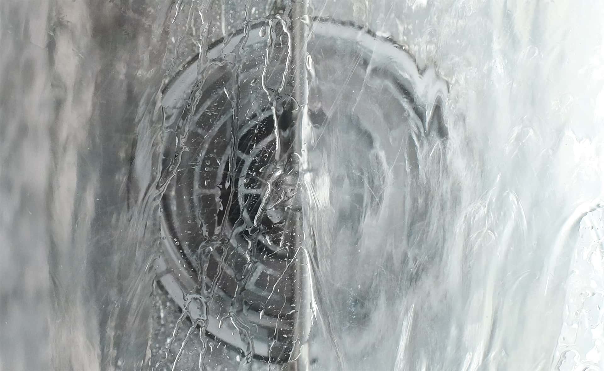Close-up of a unox oven cooking chamber being cleaned during a wash cycle