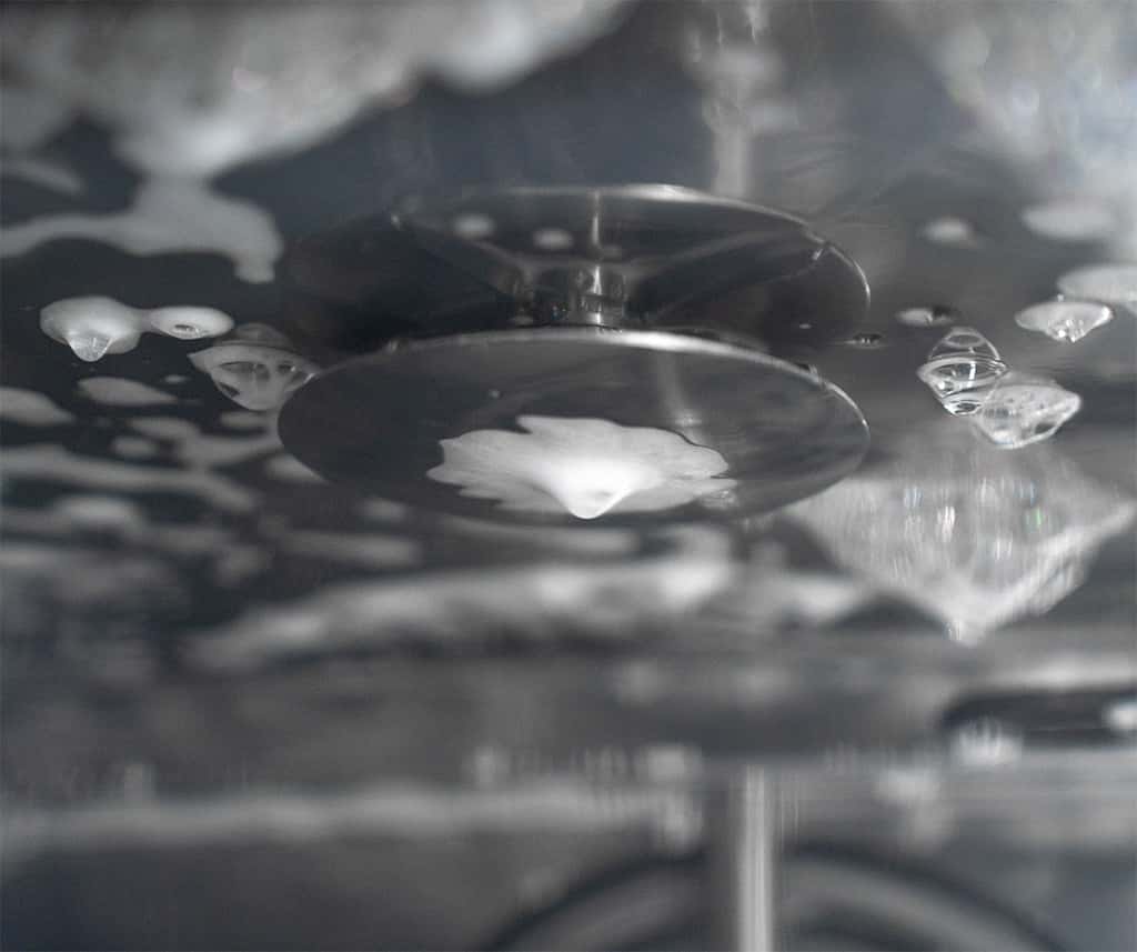 internal component of a recirculating washing system with foam and liquid detergent