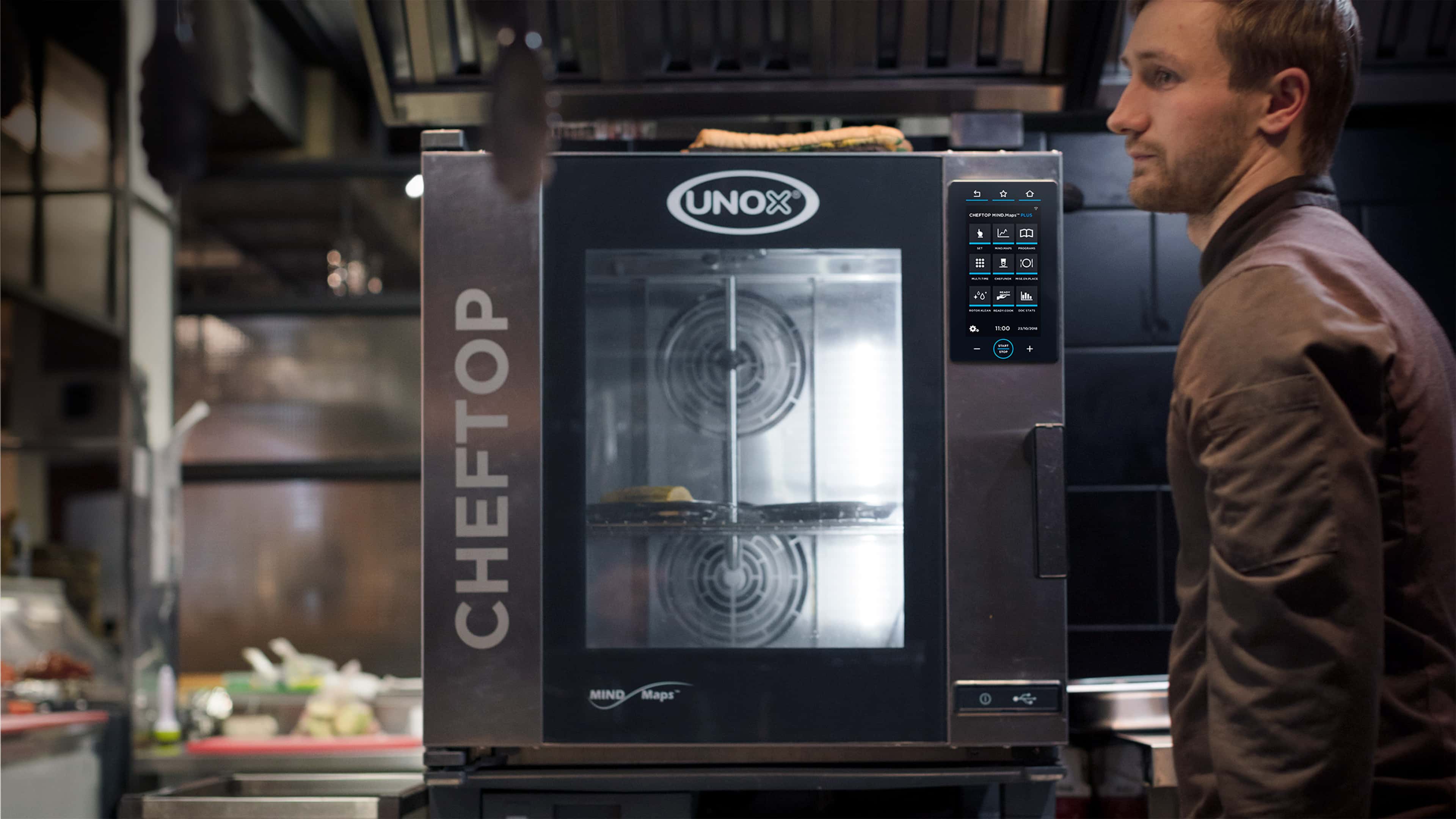 Chef using his CHEFTOP MIND.Maps™ commercial oven in the kitchen