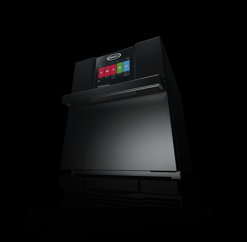 A dark, moody image of an Unox speed oven, lit so that only part of the oven can be seen, such as the Unox logo and digital display. 