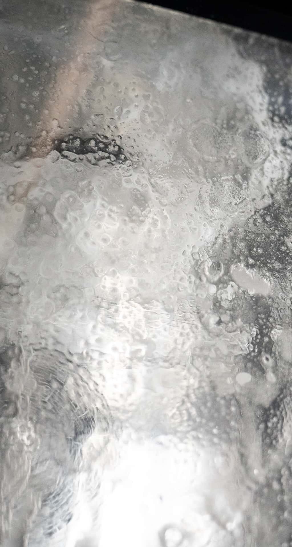 glass door of a unox commercial oven covered with detergent foam