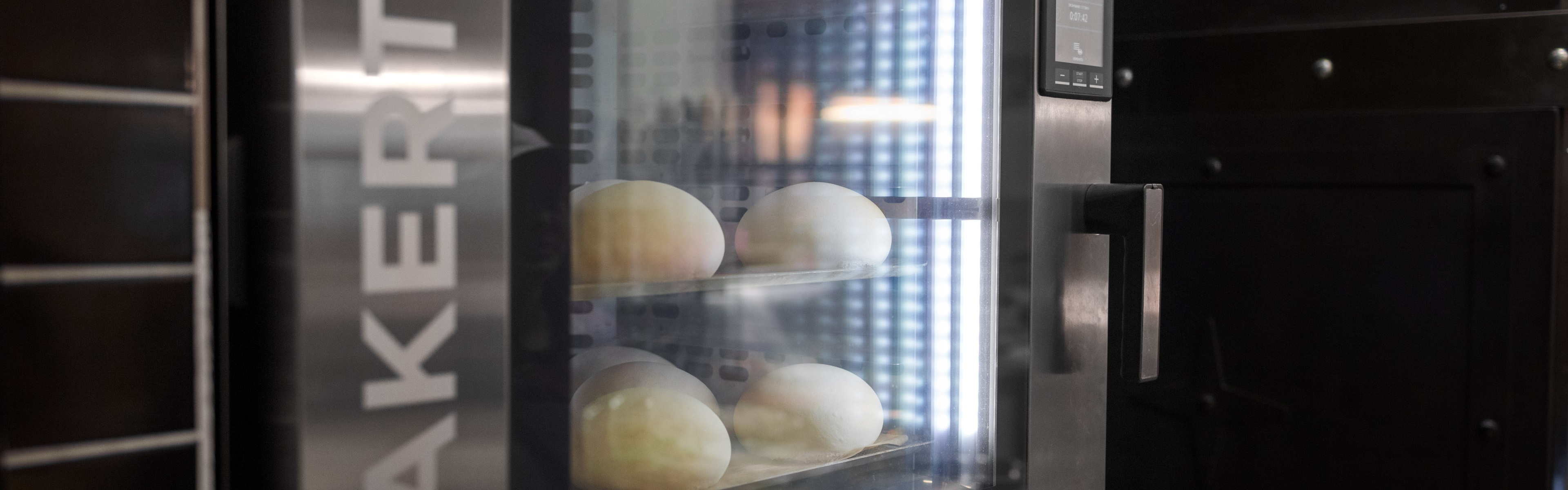 Close-up of rolls baking inside an Unox Bakertop baking oven.